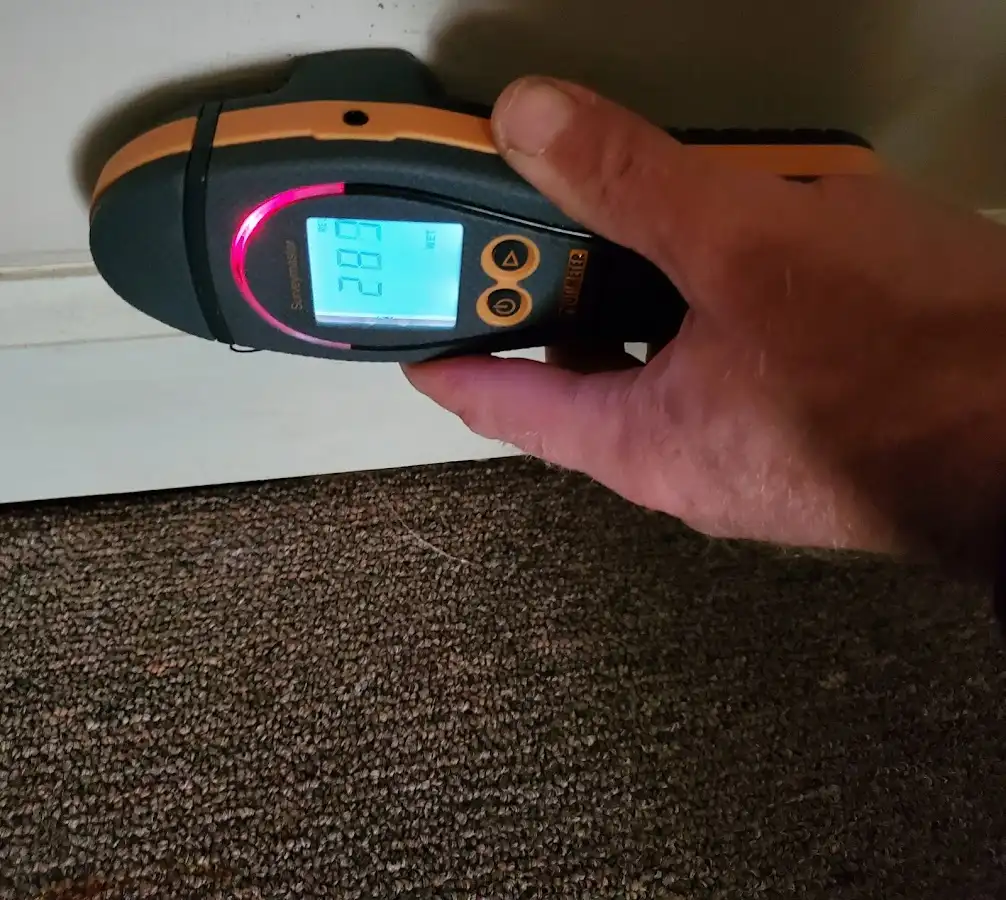 Moisture detection at baseboard during Burst Pipe Cleanup in Crowley